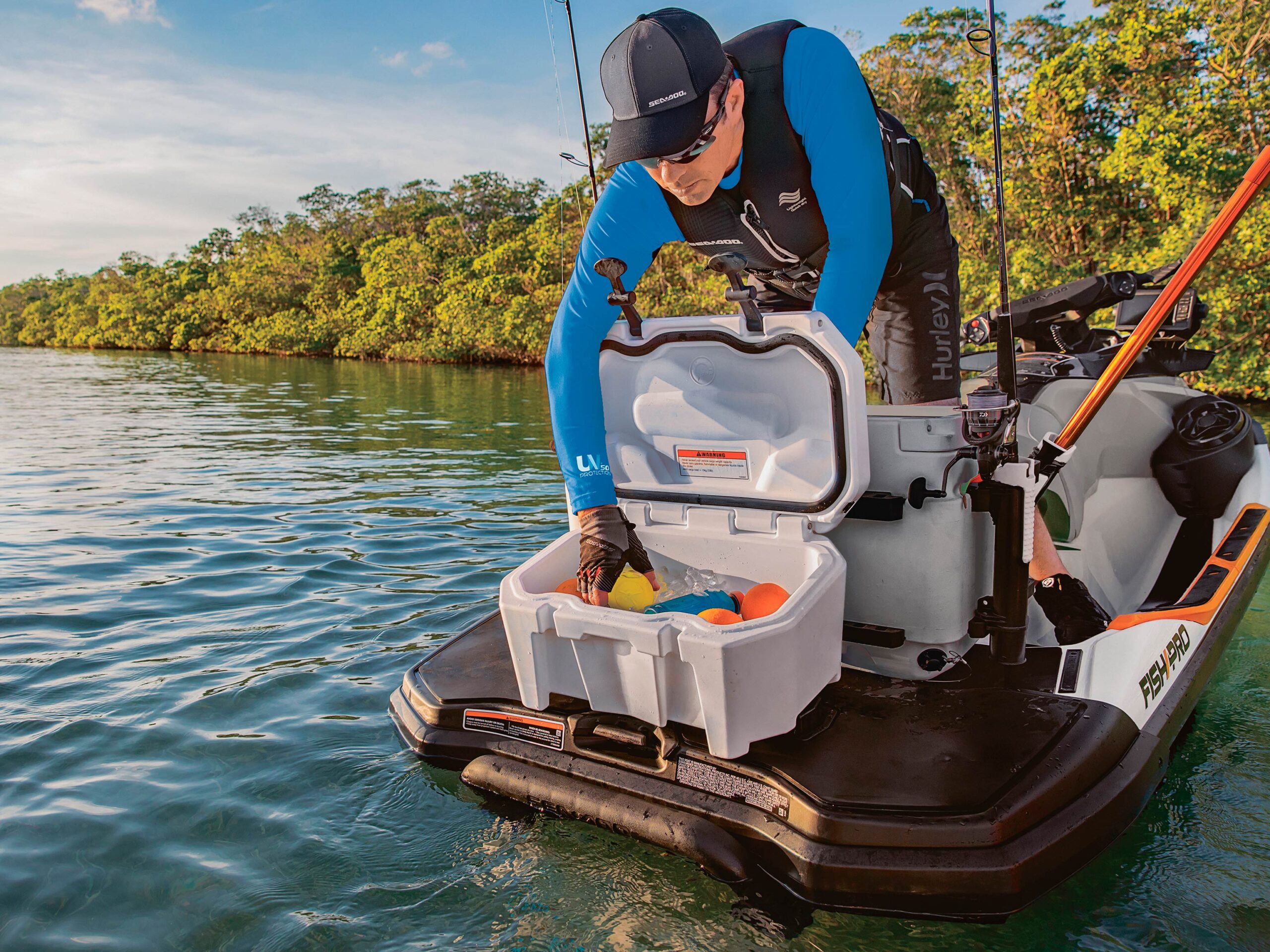 A men searching for a drink in the Sea-Doo LinQ small cooler